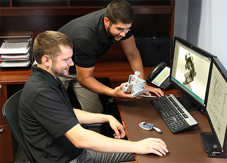 Two men working together in an office