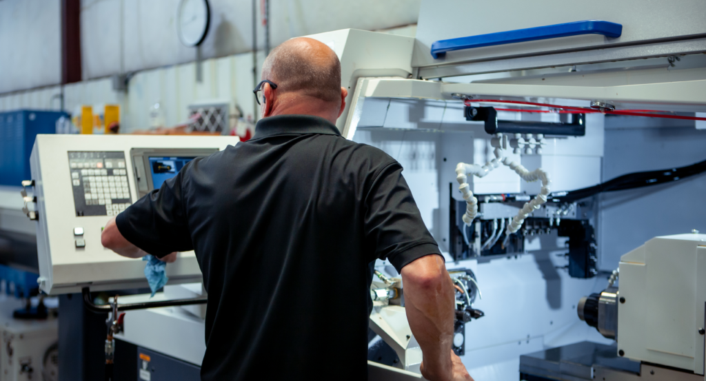 Man working on a machine screen display